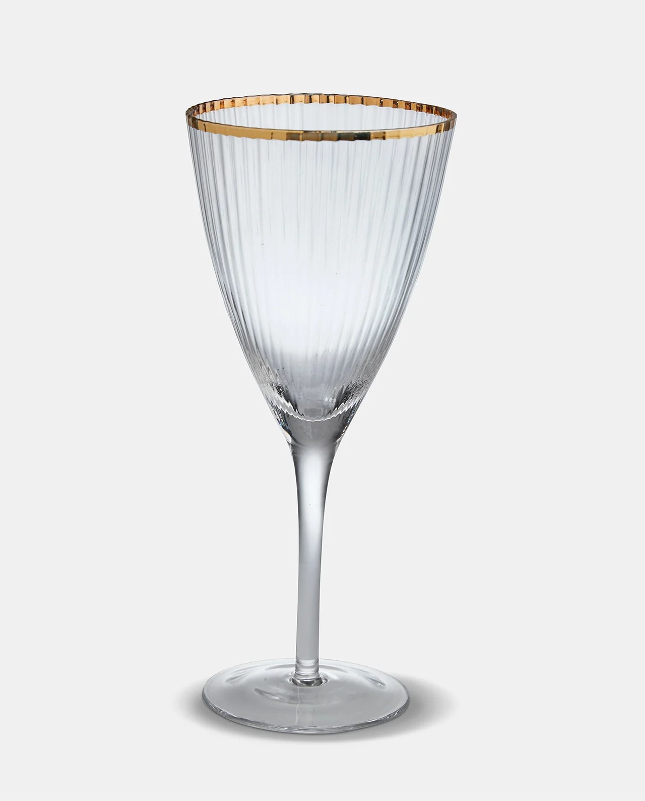 Gold-rimmed ribbed wine glass